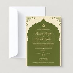 an ornate green and white wedding card