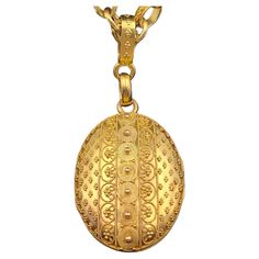 Large, stunning granulated antique French Etruscan Revival locket with the original, equally spectacular large chain. The oval locket exquisitely decorated with a technique known as granulation, where a tiny gold bead is individually applied to a surface to form a geometric pattern. Done entirely by hand and requiring a master goldsmith, this technique is thought to have originated in Sumer approximately 5000 years ago. The Etruscans mastered the process in the first millennium B.C and closely Byzantine Style Large Pendant Jewelry, Antique 14k Gold Large Pendant Jewelry, Ornate Gold Necklace With Large Pendant, Ornate Yellow Gold Oval Pendant Necklace, Luxury Byzantine Pendant Necklace, Large Locket, Enamel Locket, Gold Locket Necklace, Jewelry Photography Styling