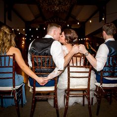 a bride and groom kissing at their wedding reception