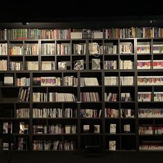 a bookshelf filled with lots of books on top of it's shelves