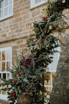 a christmas wreath on the side of a building