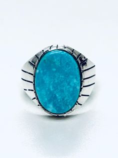 Native American Navajo handmade Sterling Silver Turquoise stone ring * Native American handmade * Navajo Tribe * Sterling Silver 9.25 * Stones: Campitos Turquoise * Length: 3/4 * width: 1/2 * Ring size: 12 US (resizing upon request. $15 charge) * Signed  For more information regarding this piece please feel free to message us. Thank you Southwestern Style Blue Turquoise Ring With Natural Stones, Southwestern Blue Turquoise Ring With Natural Stones, Southwestern Turquoise Chrysocolla Ring, Southwestern Chrysocolla Turquoise Ring, Southwestern Chrysocolla Gemstone Rings, Southwestern Style Turquoise Inlay Ring, Adjustable Southwestern Turquoise Ring With Natural Stones, Southwestern Turquoise Ring With Large Stone, Southwestern Style Turquoise Ring With Large Stone