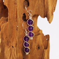 "Three juicy purple 6mm amethyst beads, stacked and outlined with sterling silver wire. This glowing purple shade is one of the hottest colors for the season, and these elegant dangles are sure to get noticed! They measure 1-5/8\" long including the sterling silver kidney earwires. Amethyst is the birthstone for February. Can also be made with 14kt gold filled wire." Small Drop Earrings, Bead Dangle Earrings, Bracelet Set Silver, Carnelian Beads, February Birthstone, Amethyst Beads, Beaded Dangle Earrings, Amethyst Earrings, February Birth Stone