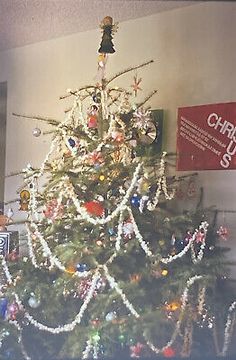 a christmas tree is decorated with lights and ornaments