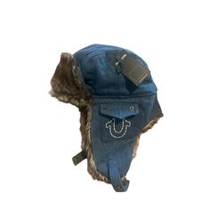 Stay Warm And Stylish This Winter With This True Religion Trapper Hat. The Faux Fur And Cotton Material Will Keep You Cozy, While The Denim Fabric Type Adds A Touch Of Classic Style. The Solid Pattern And Blue Color Make It A Versatile Accessory For Any Casual Occasion. This One Size Fits All Hat Features Lined Ear Flaps And Insulation, Making It Perfect For Outdoor Activities During The Winter Season. The Horseshoe Pockets Add A Unique Touch To The Design, Making It A Must-Have For Any Designer Trapper Hat Pattern, Fur Trapper Hat, Clothing Wishlist, Denim Cap, Trapper Hat, Trapper Hats, Man Hat, Fur Hat, Play Dress