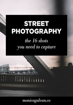 a man riding a skateboard down a street next to a tall building with the words street photography on it