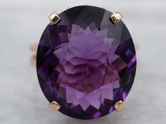 This setting is a true classic! Considered the height of fashion in the Mid Century era, the lines of this simple solitaire are clean and well balanced, providing a sophisticated look! We've set this vintage setting with a gorgeous amethyst. A deep regal purple hue, this sparkling stone glitters with intense fire from every facet.Metal: 18K Yellow GoldGem: Amethyst 10.11 CaratsGem Measurements: 17.1 x 14.9 mm, OvalRing Size: 7.50Marks: “18K” Stamped on the inside band Luxury Large Stone Amethyst Ring, Luxury Heirloom Amethyst Ring Hallmarked, Luxury Antique Amethyst Ring For Women, Luxury Elegant Gold Amethyst Ring, Yellow Gold Amethyst Ring, Vintage Setting, Amethyst Cocktail Ring, Gold Amethyst Ring, Right Hand Ring