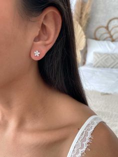 Elevate your elegance with our exquisite flower stud earrings, meticulously crafted from premium 925 sterling silver. These delicate earrings feature intricate floral designs, each adorned with shimmering zirconia stones that add a touch of sparkle to your look. The luminous zirconia stones are beautifully set to enhance the intricate flower pattern, creating a stunning effect that's perfect for both everyday wear and special occasions. With their timeless charm and versatile style, these earrin Silver Earring Studs, Cute Flower Earrings, Classic Flower Earrings With Prong Setting, Classic Flower Shaped Earrings With Prong Setting, Classic White Cubic Zirconia Flower Earrings, Classic Diamond White Flower Earrings As Gift, Classic Diamond White Flower Earrings For Gift, Fine Jewelry Flower Earrings With Brilliant Cut, Delicate Cubic Zirconia Flower Earrings For Formal Occasions