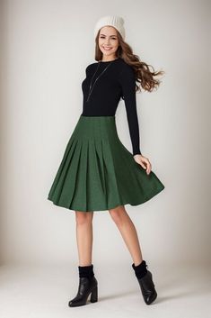 ★★ Welcome to my Ylistyle shop！！！ Stay cozy and chic in this vibrant Emerald wool Midi skirt, a must-have for the colder months! Embrace the winter in style with this versatile #WoolSkirt featuring a flattering High Waist design and a trendy Circle Skirt silhouette. Elevate your winter fashion game effortlessly with this Green beauty.  ★★FEATURES 25% wool, other fiber,nylon Polyester lining Right side zipper A-line skirt Regular fit  Circle skirt Pleated skirt Above knee length Perfect for winter, autumn ★★ Bespoke Order Service If you Request other color Request the length Your height is not between 155 cm- 172 cm Your weight is over 75 kg I can do it for you, It will need some extra fee depending on on your need. Contact with me for more detail. ★★ Get your size in Size Chart with your b Chic Green Winter Skirt, Chic Green Skirt For Winter, Green Pleated Skirt For Fall, Green Midi Skirt For Fall, Fall Green Mini Skirt For Work, Green Lined Skirt For Fall, Winter Knee-length Lined Pleated Skirt, Green Winter Midi Skirt, Green Pleated Workwear Skirt With Lining