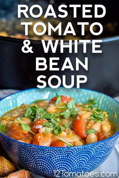 roasted tomato and white bean soup in a blue bowl with toasted bread on the side