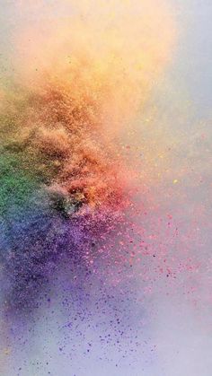 colorful powder sprinkles are flying in the air