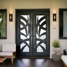 the front door to a house with two chairs and a couch in front of it