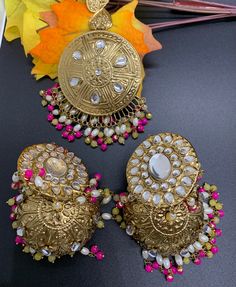 Indian Punjabi Vintage Pipal- Patti Oversized Mang tika with Jhumka earrings| Light weight| Party jewelry| Wedding Jewelry| jago jewelry | shagun jewelry | sangeet jewelry | engagement jewelry  Very Light Weight Pipal- Patti Jhumkas with oversized Mang tika. Colors - Yellow/ Pink - White - White/ Maroon High End Quality 100% Satisfaction Guarantee: Long Lasting Plating, High-Quality Stones. Perfect for any occassion-Shagun, Jago, sangeet, engagement, pre-wedding and parties.   Care: It is advisa Temple Style Kundan Jhumkas For Party, Party Kundan Jhumkas In Temple Jewelry Style, Kundan Jhumkas For Party, Temple Jewelry Style, Kundan Temple Jewelry Jhumkas For Party, Temple Jewelry Kundan Jhumkas For Party, Kundan Tikka With Latkans For Celebration, Diwali Celebration Chandbali Tikka, Chandbali Kundan Tikka For Celebrations, Kundan Chandbali Tikka For Celebration