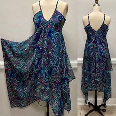 "Adjustable straps Hanky hem dress in a beautiful paisley print. V-neck Flowy This dress will fit a size M-L Center front length from strap joint 37\" Length from start joint to longest point 50\" Sweep 112\" Bust 34\"" Sleeveless Patterned Paisley Print Maxi Dress, Sleeveless Patterned Maxi Dress With Paisley Print, V-neck Beach Sundress With Paisley Print, V-neck Paisley Print Beach Sundress, Beach Sundress With V-neck And Paisley Print, Assymetric Dress, Hanky Hem, Paisley Print Dress, Hem Dress