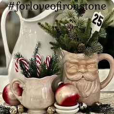 two ceramic mugs with christmas decorations in them and the words for love of irontone