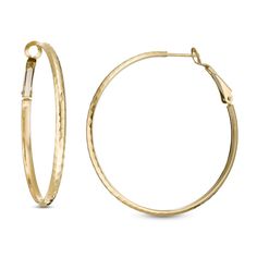 These 44.7 x 3.1mm hoop earrings are fashioned in 14K gold with a hammered finish and secure with omega backs. Modern Hammered Hoop Earrings For Formal Occasions, Modern Hammered Hoop Earrings For Formal Events, 14k Gold Hammered Hoop Earrings, Elegant Hammered Hoop Earrings, Elegant Hammered Round Hoop Earrings, Yellow Gold Hammered Metal Hoop Earrings, Small Hammered Hoop Earrings For Formal Occasions, Formal 14k Gold Hammered Hoop Earrings, Formal Hammered 14k Gold Hoop Earrings