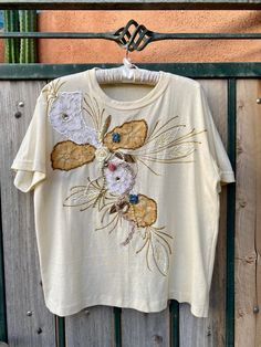 "Vintage 1980s - 1990s pale yellow women's t shirt. Beautifully embellished on front from its era with gold beads, pearls, lace flowers & leaves, ribbon florals, gold glitter outline, hand painted & more! Very shabby chic cute! No tags on this short sleeve T shirt that simply slips on overhead. Fits women size Large. Further measurements of: Shoulder to hem = 24\" Pit to pit = 22\" Waist = 21\" measured on 1 side when laying flat." Black Stretch Lace, Vintage Closet, Strapless Lace Dress, Lace Strapless, Fits Women, Rose Lace, Quality Dresses, Lace Flowers, Short Sleeve T Shirt