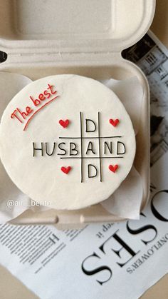 a cake in a box that says the best husband d is for dad on it