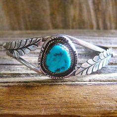 DESCRIPTION: Antique collectible Navajo artisan handmade sterling silver unisex design cuff bracelet with large turquoise stone with desirable matrix. According to experts, at this date, there is not enough Turquoise being mined to fill the domestic or the international demand, and most of the top mines have closed. Turquoise is becoming rare. This kind of vintage quality is why we love it so much...heavy sturdy precious metal, handmade artisan craftsmanship and distinctive design.  You will lov Adjustable Artisan Sterling Silver Bracelet, Bohemian Adjustable Untreated Bracelets, Adjustable Sterling Silver Bohemian Bracelet, Artisan Adjustable Bracelets Stamped 925, Bohemian Adjustable Cuff Bracelet Stamped 925, Artisan Adjustable Untreated Jewelry, Untreated Adjustable Artisan Jewelry, Artisan Sterling Silver Bracelet, Bohemian Adjustable Untreated Jewelry