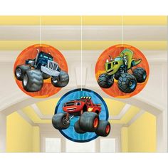 three cars hanging from the ceiling in a room