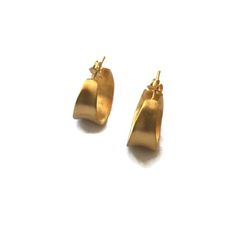 Modern small gold hoops with a modern antiquity feel to them. Cast in silver and plated in 18 K gold.  Light weight post earrings  Details:20 mm diameter .8 inchesWidth at widest point 10 mm  .4 inchesI other hoops in this series https://www.etsy.com/shop/SHERIBERYL?ref=seller-platform-mcnav&search_query=concave+hoopsJoin the club! be in the know for sales, new products , special promotions & flash sales! and receive a GIFT CARD  http://eepurl.com/qhQIv Modern Gold Hammered Hoop Earrings, Contemporary Yellow Gold Hoop Earrings, Elegant Gold Hammered Huggie Earrings, Gold Small Hoop Contemporary Earrings, Elegant Handmade Yellow Gold Huggie Earrings, Contemporary Everyday Gold Jewelry, Elegant Hammered Gold Huggie Earrings, Contemporary Gold Hoop Earrings As Gift, Handmade Yellow Gold Huggie Earrings