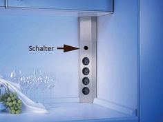 an image of a wine rack with bottles and glasses in it, labeled schatter