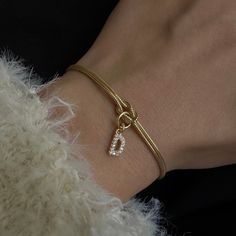 CUSTOM INITIAL LOVE KNOT BRACELET Material: 18 carat gold plated high quality solid 925 Sterling Silver Color options: Silver, gold and rose gold. Bracelet length is different for men and women. 6" (15+5 cm) with 2" extension for women 7" (18+5 cm) with 2" extension for men All bracelets come with a 2" extension chain so you can adjust it to your wrist. **HOW TO CARE FOR YOUR JEWELRY *Maintain your jewelry's high shine by avoiding contact with any chemicals such as soap, perfume, lotion, makeup, Gold Sterling Silver Bracelets For Mother's Day, Anniversary Silver Gold-plated Chain Bracelet, Mother's Day Gold Sterling Silver Bracelets, Dainty Jubilee Charm Bracelet For Anniversary, Adjustable Gold Charm Bracelet In Sterling Silver, Classic Gold Plated Charm Bracelet Gift, Tarnish Resistant Charm Bracelet For Anniversary, Gold-tone Jewelry Bracelet Strap For Gift, Elegant Metal Name Bracelet For Mother's Day