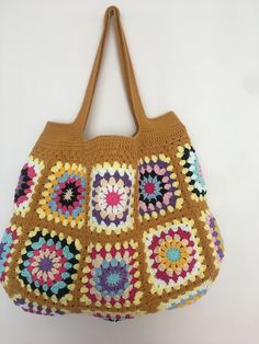 Mustard Color Crochet Granny Square Long Handle Shoulder Bag, Crochet Bag, Summer Bag, Crochet Totes, Granny Bag, Crochet Tote Bag Handmade This beautiful handmade bag 🌸 is perfect for completing your outfits. 55% Cotton - 45% Pac Light and handy Width: 45 cm - 17,3 inch Length: 33 cm - 12,9 inch Overall height with bag handle approximately : 55 cm - 21,6 inch There is one inner pocket. Dry cleaning recommended 🌸 Thank you so much 🌸 Multicolor Crochet Bucket Bag, Beige Granny Square Shoulder Bag, Multicolor Crochet Bucket Shoulder Bag, Yellow Crochet Rectangular Shoulder Bag, Everyday Brown Crochet Bag With Granny Square, Brown Crochet Tote Bag With Granny Square, Everyday Crochet Bag With Granny Square, Brown Crochet Bag With Granny Square Design, Brown Rectangular Crochet Bag With Granny Square