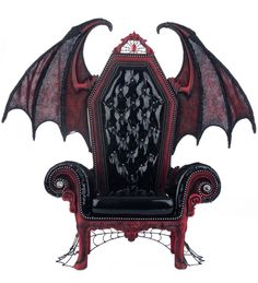 a chair with a bat shaped back and wings on it's arm, sitting in front of a white background