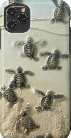 an iphone case with sea turtles and sand on the phone cover, which is designed to look like they are swimming in the ocean