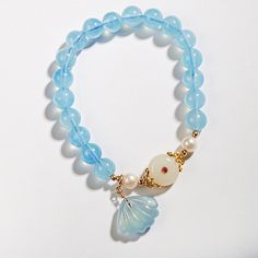 Aquamarine Shell Bracelet - BTSAN PO Elegant Light Blue Jewelry With 8mm Beads, Blue Pearl Bracelet With Natural Round Beads, Blue Round Jewelry With Pearl Charm, Elegant Blue Pearl Bracelet With Natural Stones, Elegant Blue Beaded Bracelets With Pearl Charm, Blue Gemstone Pearl Bracelet For Gift, Blue Pearl Bracelet With Natural Stones, Blue Pearl Bracelet Gift, Elegant Blue Beaded Bracelet With Pearl Charm