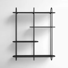 a black shelf with three shelves on the top and one in the middle, against a white wall