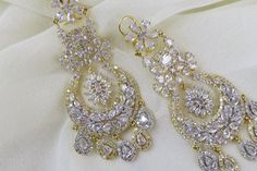 White CZ Diamond Earrings Indian Pakistani bridesmaid wedding jewelry in silver plating Indian Jewelry are always a part of all the Indian celebration around the globe . One definitely complete her look once they own it . Beautiful  Indian cz earrings are plated in rhodium plating for longer lasting. This artistic Earrings looks beautiful  and elegant perfect for all occasion on any outfits you choose to wear (saree, salwar suits, lenga, etc.) *High quality craftsmanship 100% satisfaction guarantee  *Plated in rhodium plating *Earring Closure screw back on earring  *base metal for earrings is brass * Earring length 7cm *Earring width 3cm  *package include earrings  *ready to ship from Houston TX United States GIFT- It comes in gift box perfect for gifting to your mom , sister, in laws, fri Elegant Bridal Earrings With Stone Work For Reception, Elegant Bridal Earrings With Stone Work In Cubic Zirconia, Elegant Stone Work Bridal Earrings For Reception, White Hand Set Chandelier Earrings For Party, Teardrop Jewelry With Intricate Design For Wedding, Teardrop Wedding Jewelry With Intricate Design, Elegant Dangle Chandelier Earrings With Stone Work, Hand Set White Bridal Earrings For Party, Elegant Chandelier Earrings With Stone Work