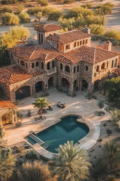 an aerial view of a large house with a pool