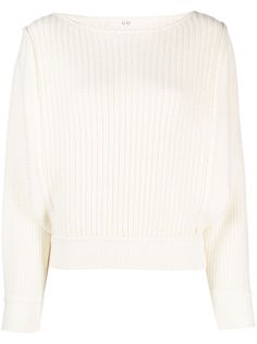 the cropped sweater in white is an all - over, rib knit top with long sleeves