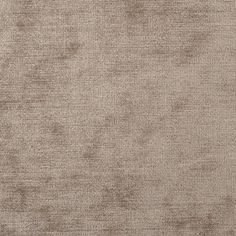 a beige background with some very small spots on the fabric and it looks like something out of