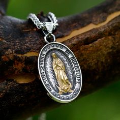 Embrace divine protection with our Guadalupe Medallion. This exquisite pendant features a detailed depiction of Virgin Mary, rendered in a stunning two-tone finish. The central golden figure radiates against an antique silver background, encircled by stars and a meaningful inscription. Crafted with meticulous attention to detail, this piece serves as both a spiritual talisman and a work of art. Whether worn as a personal devotional or gifted to a loved one, this medallion offers a daily connection to faith, hope, and celestial guidance. Vintage-inspired design with strong religious symbolism Premium 316L stainless steel - Lightweight, hypoallergenic and tarnish-resistant Retro chain included (24 inches length) With bail 45mm x 28. Without bail 35mm x 28mm Virgin Mary Pendant - Symbol of Pu Silver Our Lady Of Guadalupe Pendant Jewelry, Silver Virgin Mary Pendant Jewelry, Silver Spiritual Virgin Mary Jewelry, Spiritual Silver Jewelry With Virgin Mary, Spiritual Silver Necklace With Our Lady Of Guadalupe, Guadalupe Necklace, Virgin Mary Pendant, Silver Background, Vintage Inspired Design