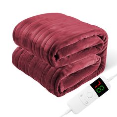 a blanket and thermometer on a white background