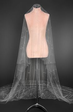 a mannequin with a veil on top of it