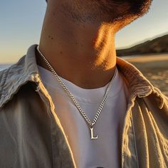 Discover the epitome of elegance and personalization with our Personalized Silver Initial Necklace - a minimalist yet profoundly meaningful piece of men's jewelry, perfect for gifting. This meticulously crafted necklace features a sleek, silver initial pendant, designed to celebrate individuality and style with a subtle, sophisticated touch. Ideal for any occasion, this necklace serves as a remarkable gift for him, whether it's for a birthday, anniversary, or just a thoughtful gesture to show yo Men’s Silver Necklace, Elegant Stainless Steel Necklace For Father's Day, Minimalist Stainless Steel Jewelry For Personalized Gifts, Initial Pendant Jewelry With Curb Chain For Gift, Silver Minimalist Initial Necklace, Personalized Silver Minimalist Chain Necklace, Minimalist Silver Initial Necklace, Gift Jewelry With Initial Pendant And Curb Chain, Minimalist Stainless Steel Necklace For Father's Day