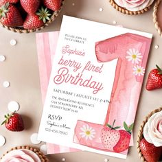 a pink birthday card with strawberries and cupcakes around it on a table