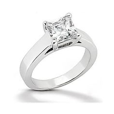 a white gold ring with a princess cut diamond