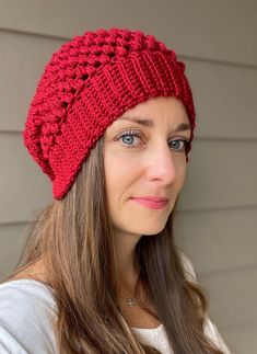 a woman wearing a red knitted hat