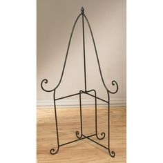 a metal rack with two hooks on it