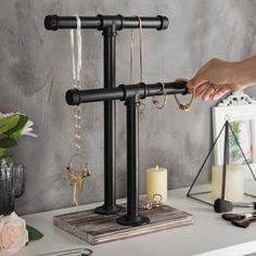 Whether organizing your personal collection at home or showcasing merchandise in a boutique, this jewelry rack is an excellent decorative storage solution and is ideal for placement on your dresser, table, or countertop surface. Williston Forge | Williston Forge Decorative Black Pipe Jewelry Stand Organizer 18.35 H x 6.65 W x 11.77 D in black / brown / grayWood / Metal in Black;brown | 18.35" H X 6.65" W X 11.77" D | Wayfair Jewelry Display Booth, Jewerly Display, Wood Jewelry Display, Dresser Table, Diy Jewelry Display, Jewelry Rack, Jewelry Displays, Black Pipe, Necklace Stand