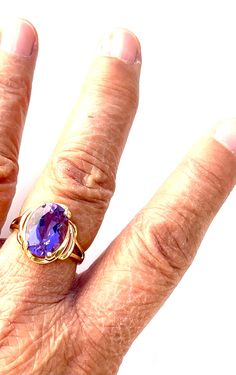 Vintage 14k yellow gold ring engagement ring promise ring with 8 ct faceted amethyst cabochon size 8 3/4 US circa 1980's. Such a beautiful ring. Hallmarked 14k and the amethyst is in great condition such a lovely ring that can make a lady very happy. Classic Amethyst Ring Stamped 14k, 14k Gold Amethyst Solitaire Ring, Fine Jewelry 14k Gold Amethyst Ring With Round Cut, Hallmarked Yellow Gold Oval Crystal Ring, Hallmarked Oval Yellow Gold Crystal Ring, Formal 14k Gold Amethyst Ring, Heirloom Tanzanite Rings In Yellow Gold, Heirloom Tanzanite Yellow Gold Rings, Collectible Sapphire Ring In 14k Gold