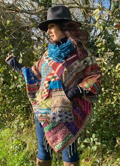 Patchwork Poncho by Festival Stall (Please note we have a matching skirt available in our shop - shaggy scarfs also available- mix and match) ONE SIZE fits most- These  beautifully vibrant colourful patchwork poncho have been handmade, each one is totally unique.  Perfect for a layered winter look, these poncho literally match with anything, wear a turtle neck or roll neck jumper underneath and team them up with a pair of cowboy boots and your favorite pair of jeans, layer up with jumpers or swe Winter Hippie Outfits, Simple Garments, Patchwork Poncho, Winter Cloak, Festival Mode, Boho Poncho, Winter Poncho, Poncho Knitting Patterns, Patchwork Coat