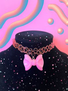 Bubblegum pink bow choker. Rubber choker stretches to fit neck comfortably. Cute Adjustable Choker For Parties, Pink Bow Necklace For Party, Cute Pink Choker For Party, Adjustable Pink Trendy Choker, Pink Adjustable Choker For Party, Pink Trendy Adjustable Choker, Adjustable Pink Choker For Party, Pink Adjustable Trendy Choker, Pink Adjustable Choker As A Gift