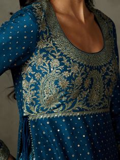 Editor's Note Step into timeless elegance with our midnight blue ari-hand-embroidered ashvika kurta, perfectly paired with garara pants and a coordinating dupatta. This ensemble exudes grace and style, making it an ideal choice for special occasions and events where you want to showcase your classic and sophisticated fashion sense. The intricate embroidery and rich color ensure you make a lasting impression with this timeless attire. Fabric: Silk flat dupion Color: Blue Components: Kurta, garara Blue Chikankari Embroidery Palazzo Set For Reception, Blue Palazzo Set With Chikankari Embroidery For Reception, Blue Palazzo Set With Resham Embroidery For Festive Occasions, Festive Blue Sharara With Straight Kurta, Blue Sharara With Straight Kurta For Festive Occasions, Festive Blue Palazzo Set With Resham Embroidery, Blue Anarkali Raw Silk Palazzo Set, Blue Anarkali Style Raw Silk Palazzo Set, Blue Straight Kurta Set For Reception