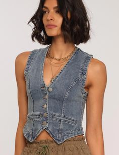 The Denny Vest is an effortlessly cool wardrobe classic. It's made of our airy denim and has a slim fit with classic button details.[split]DenimSlim fitHorn buttons98% Cotton / 2% SpandexLength: 20.5" from high point of shoulderMeasurements from Size S